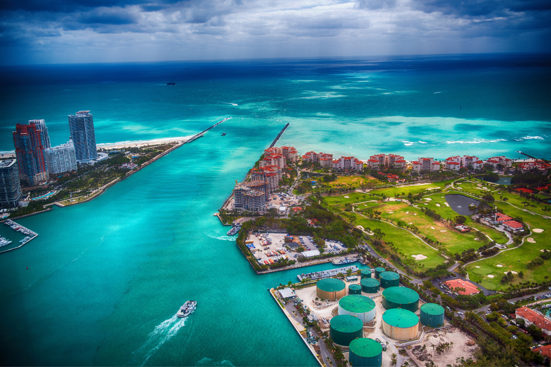 Aerial view of Miami Beach and Fisher Island, showcasing the blue waters and luxury real estate